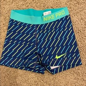 Blue patterned Nike Pros